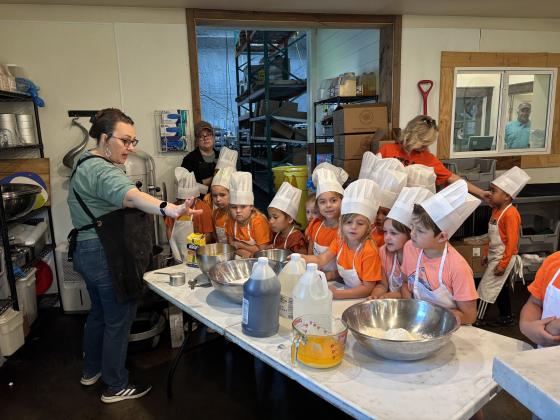 SSES Kinder students from Mrs. Ceci’s, Mrs. Bessett’s, and Mrs. Oliver’s classes are seen here watching a demonstration on how to make a pecan pie - Millican Pecan Company style!