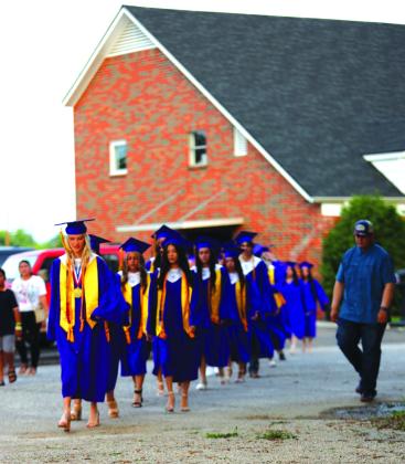 San Saba seniors make their way to Rogan field for the graduation ceremony on Friday, May 23,2025 | Photo by Kayti Lackey