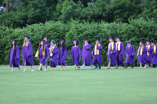 San Saba seniors make their way to Rogan field for the graduation ceremony on Friday, May 23,2025 | Photo by Kayti Lackey