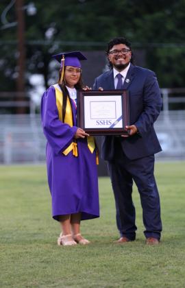 Carol Tagle with Principal Andreas Aguirre receiving her Salutatorian Award | Photo by Kayti Lackey