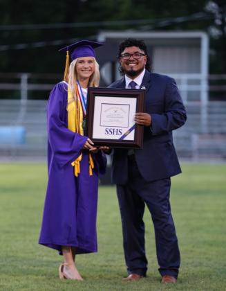 Gracen Shahan receives her Valedictorian certificate from Principal Andreas Aguirre | Photo by Kayti Lackey