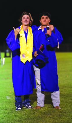 Jordan Whitney and Alex Estrada pause for one final picture after graduation | Photo by Kayti Lackey