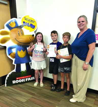 Bird Poster Contest Winners - 4th Grade:  Tessa Johnson, Dominic Collins, MJ Bagley, and teacher Mrs. Kelley Cash