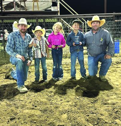 Mutton Busting Champions are Rawlee Stewardson, Easton Deeds, and Zoe Poe. They are pictured with directors Winston Poe and Nick Taylor.