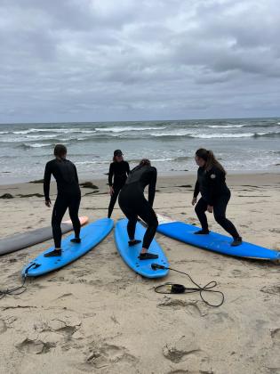 HPU students take surfing lessons before going out on the water.