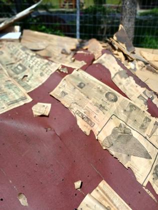 Newspaper covered floor that was uncovered