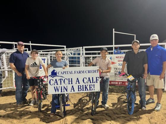 Calf scramble winners- Friday night | Capital Farm Credit representives,Vance Bauer and Marcus Amthor, awarded bicycles to Mason Rogers, Reese Eckert, Bobby Verette, and Rexton Hunt.