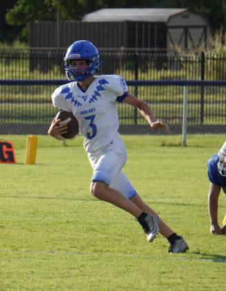 Cherokee Indian Jaxon White carrying the ball in the scrimmage against Rising Star