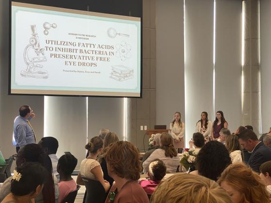 Students in Summer Research Symposium at HPU demonstrated their research findings during evening presentations on Tuesday, August 5.