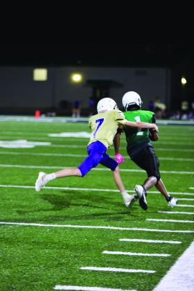 #7 Luke Bagley makes a racing sideline stop for the 8th grade Dillos in their 32-0 win against Burnet last Thursday.