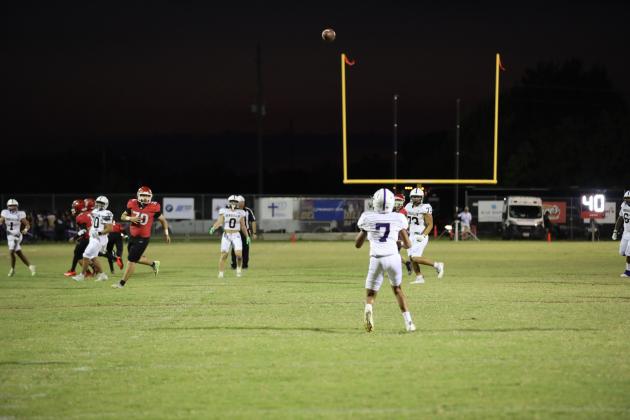 #7 Brandon Gonzales makes a stunning catch from #1 Luke Tharp in last week's game against Katy.