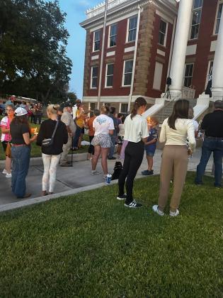 Getting ready for the candle lighting ceremony. Photo by Kenneth Pierce