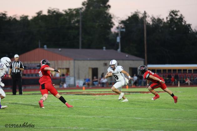 #8 JJ Romero pitching the ball back to #0 Jason Everett who had 23 carries for 101 yards rushing