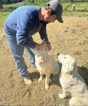 Mr. Baker giving a vaccine.