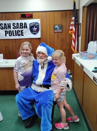 Gentry Bohannon and Huntleigh Bohannon tell Santa what they want for Christmas. Photo by Carolyn Preece