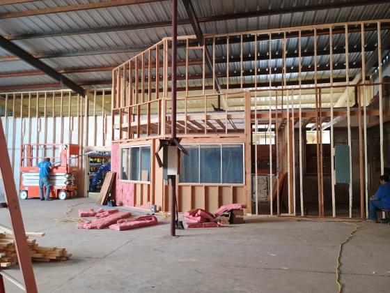 The biggest part of the store is now empty and ready to be the new showroom!  This section (behind the demolition in the front) will be the new showroom. Shown here is the new office space behind the front counter space. Photo by Djuana Payton