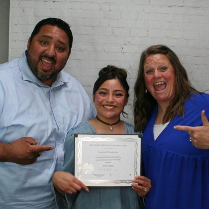 Izzy and Valerie Valdez congratulating Lauren on her success! They were her mentor parents in the transitional living program.