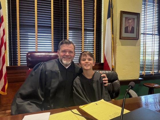 County Judge Jody Fauley with acting judge Hugh Henslee. Fun fact, Hugh’s greatfather used to be our county judge. His pictured is framed to the right.
