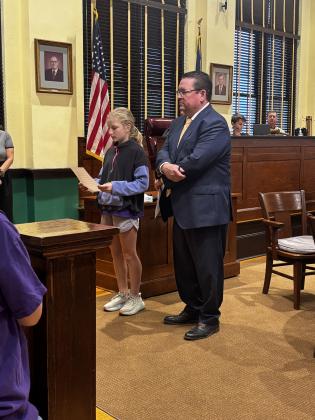 Attorney Russ Baker and Hadley Fuller helped Edwiin Tovias with his case of the missing carrots