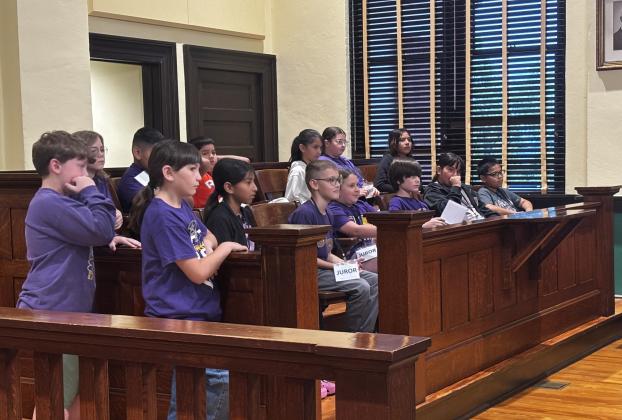 Our fourth grade jurors - Anlee Boswell, Anival Vazquez, Aaron Martinez, Adelyn Sixetos, Reagan Hay, Rocio Argote in the back. Abigail Davila, Dayler Barrier, Blayke Lozano, Luke Nazier, Jeimy Ortiz, and Jovani Canedo-Cervantes in the front row. Officers Michael Vallenavedo and Leigha Turner on the side.