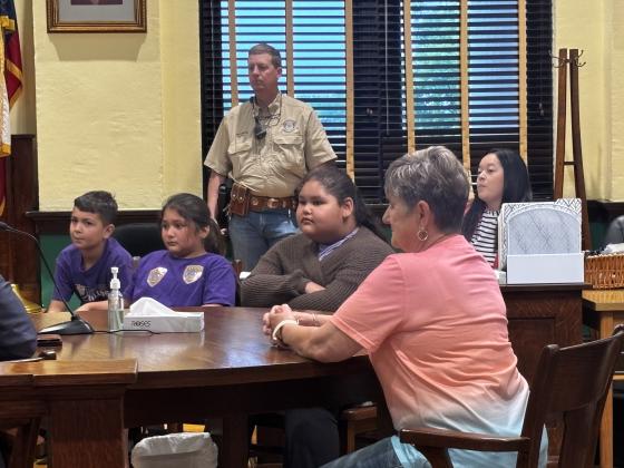Mrs. Wells pictured with  Levi Palacio and Evelyn Coronado acting as the sheriff’s office. Rosalena Vasquez worked with Christi Whitley as the county clerk.