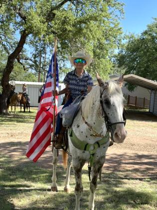 Gus Latta with the Best Cowboy Award and carrying our colors in the parade