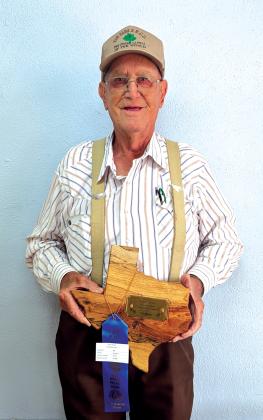 Jackie Brister came by the news office this week to show us his well-earned trophy! Photo by Yvonne Contreras