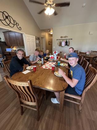 Group enjoying lunch in a cottage