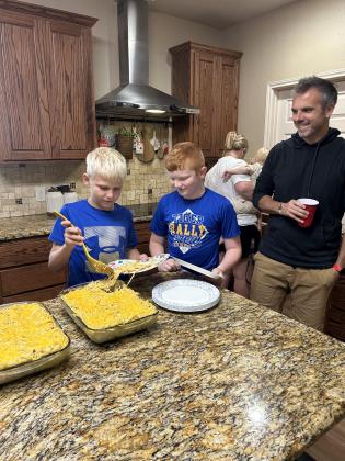 Chaperone, Justin and boys from Westhill taking a lunch break at a cottage