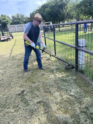 Youth minister, Brandon, weedeating