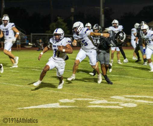 #55 Jose Vega blocks for #11 Melvin Umble. Umble had 75 yards and 2 TD.