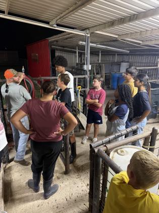 Vocational Program Coordinator, Ryan Duggan, giving a pig program orientation
