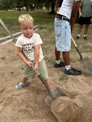 Hutton helping scoop sand