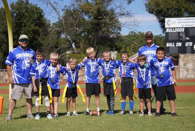 Flag Football team: Coach Travis Shannon, Gus Latta, Dallas Bryan, Wylie McKneely, Micah Darrow, Griffin White, Brantley Shannon, Ryker Williams, Sean Trinidad, and Coach Cody McKneely. Courtesy Susan Shannon