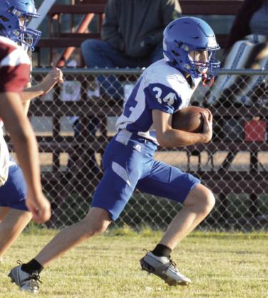 Indians #34 Preston Hanley gains yardage against the Eagles