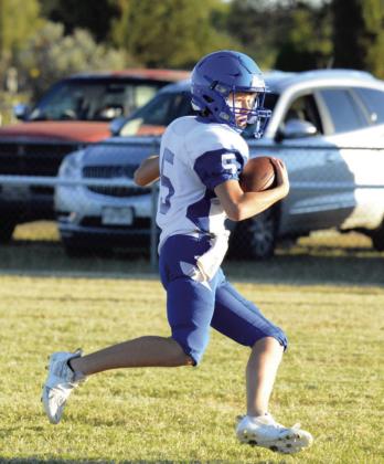 Cherokee’s #5 Jaxon White takes the ball down the field