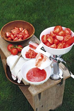 Tomato press and sauce makers turn garden-ripe tomatoes into a seed-free, skin-free sauce with the turn of a handle. Photo courtesy of Gardener’s Supply Company/gardeners.com