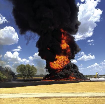 This photo shows that even though you can no longer see any signs of the plastic structures, the fire is still going strong. Courtesy of Wyatt Deans, County Liason Officer