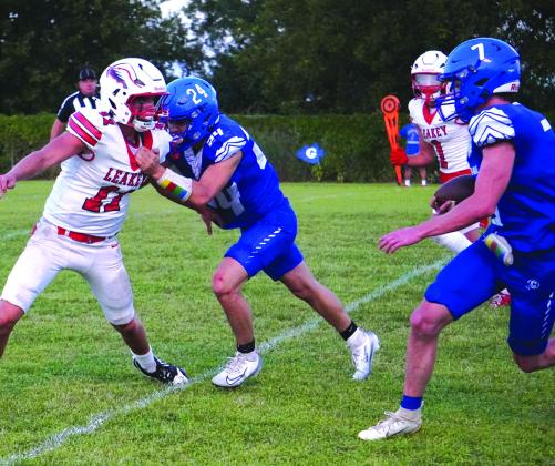 Here is Preston Hanley with some intensity as Cayden Houston carries the ball against Leakey in the varsity game. Courtesy Valerie Valdez