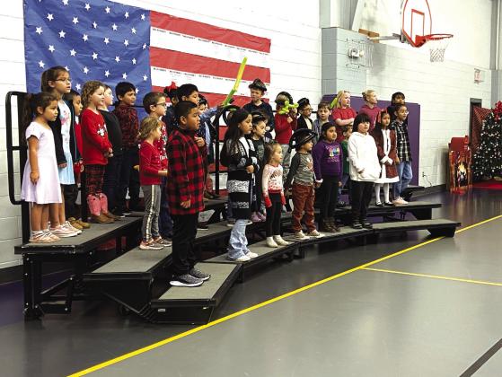 Various aged SSES students singing