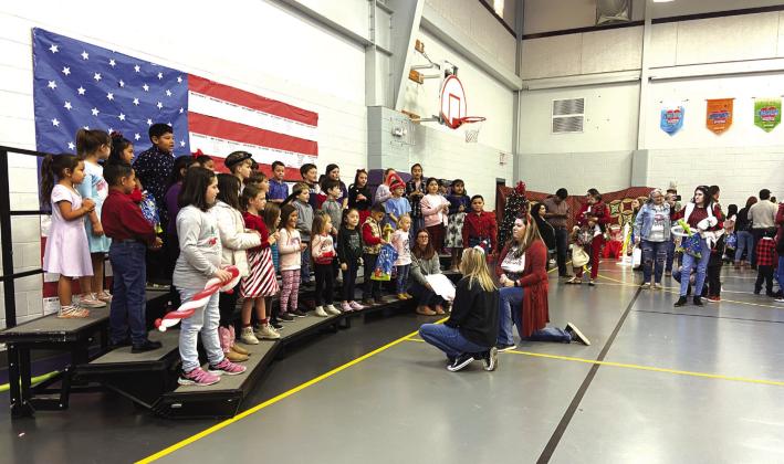 Various aged SSES students singing