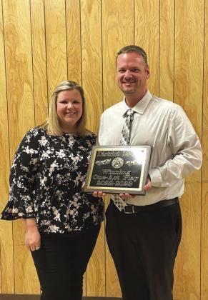 Directors Chans and Misty Moellendorf proudly holding their award