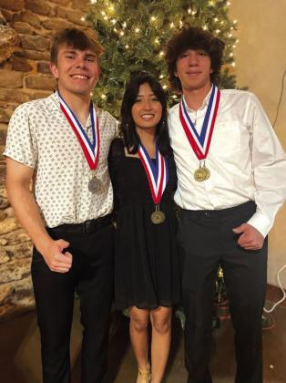 Everett Eidson, Karol Guerrero, and Jose Aguilera wearing their All-District honor medals