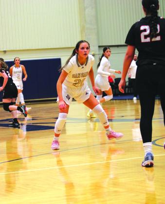 #20 Ema Argote puts the pressure on to stop the ball.