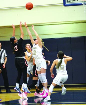 #10 Brooklyn Allison getting a defensive hand on a shot off of Refugio.