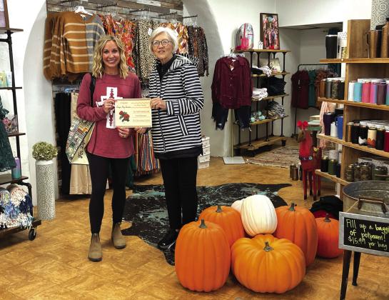 First place business: Sings My Soule Boutique; Pictured are Talor McGuire, owner, and Rhonda Killion of the SS Garden Club.