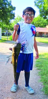 Maui Jimenez, age 11, went fishing at Bend and caught a 10 lb channel cat using a rod &amp;amp; reel and night crawlers for bait. Maui said, 'This is my first big fish ever!' Courtesy of Javier Jimenez