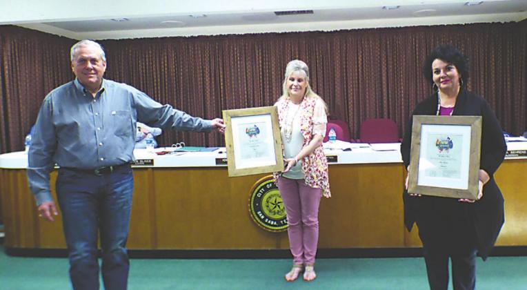 Judge Sharon Blossman (middle) swore in newly elected officials, Mayor Ken Jordan (left) and Alderman Oleta Behrens (right), at the City Council meeting on May 12th. The elected officials are holding their framed oaths. Photo by Djuana Payton