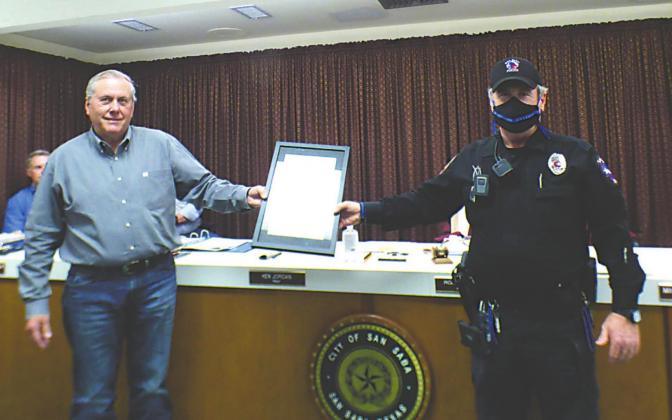 Mayor Ken Jordan is shown presenting an engraved plaque to Police Sergeant Charlie Boyce on behalf of all members of San Saba Police Deparment in honor of National Police Week (May 10th-16th) which is recognized annually. Photo by Djuana Payton
