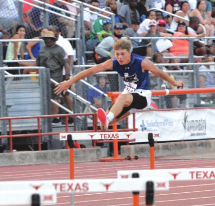 Jadeyn Bryant, senior at Richland Springs High School, starts his sprint over a hurdle at the 1A Track Meet held in Austin last Friday and Saturday. He made the podium by earning a bronze medal in the 300-meter hurdles with a time of 40.12 seconds. (Photo courtesy of Rita Boultinghouse)